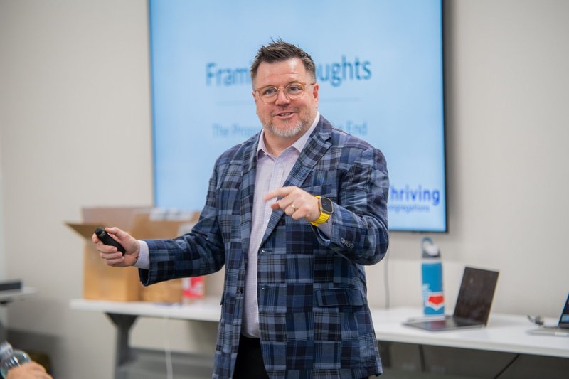 Chris Aho speaking at a conference